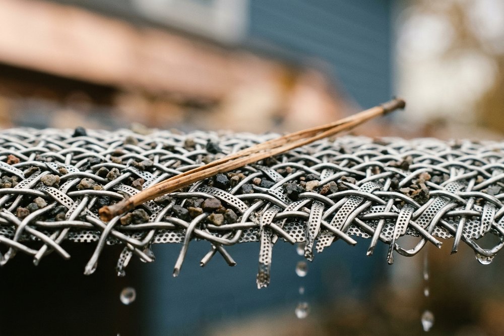 Close-up of micro-mesh guard surface stopping small debris